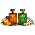 Two bottles of Lepro Plus perfume. One is orange and called "Aramis". The other is green and called "EvoKiss". They are surrounded by fruit, flowers, and other botanicals.