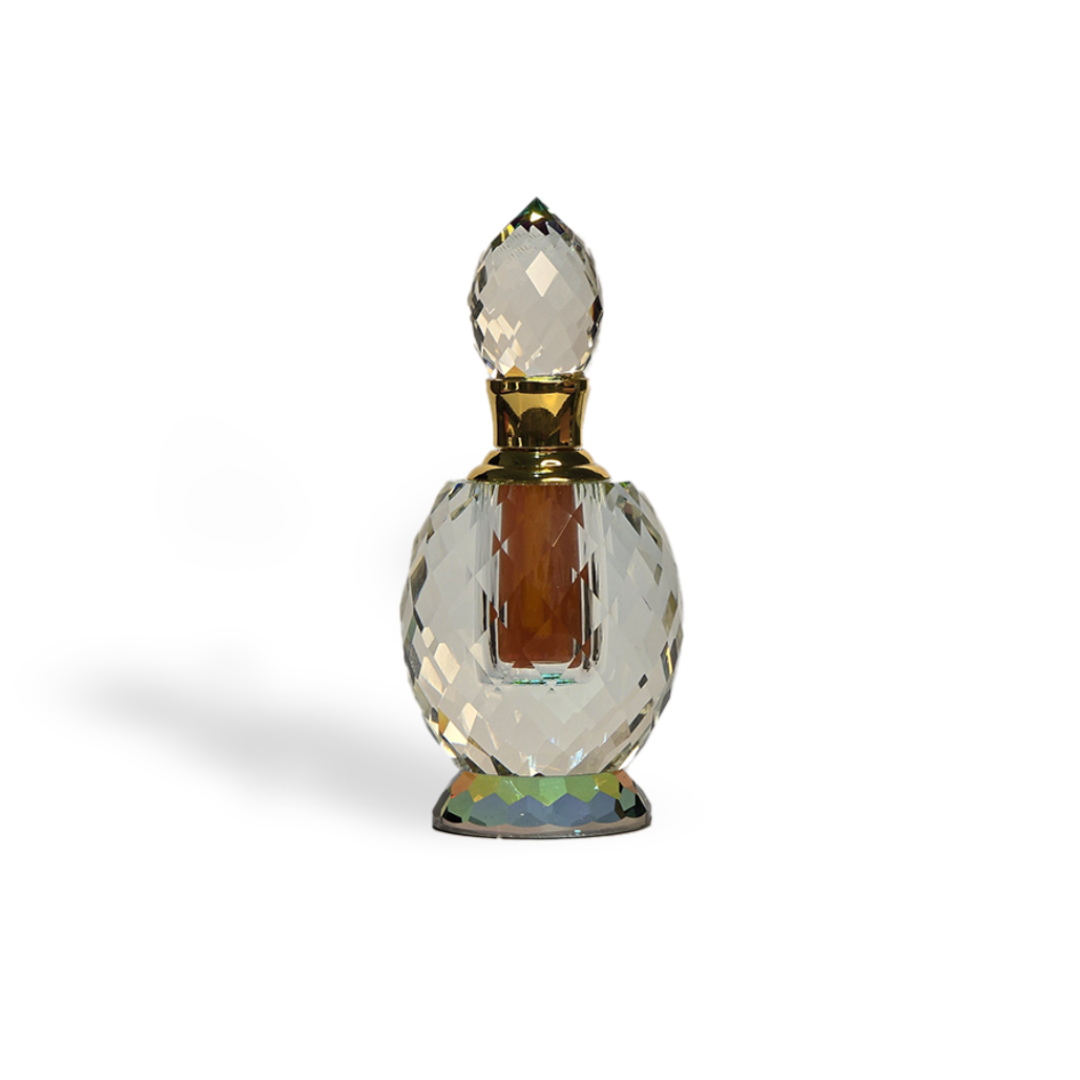 Crystal perfume bottle with gold accents.
